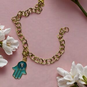 Hand Crafted Gold Bracelet with Blue Charm
